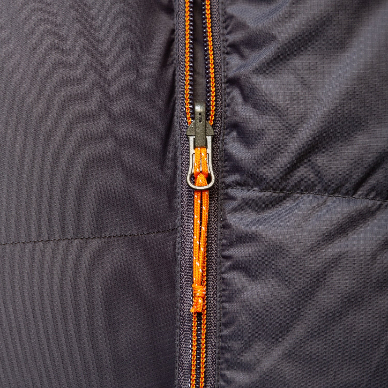 Mountain Equipment Glacier Expedition Sleeping Bag in Obsidian packed into waterproof roll-top stuff sack