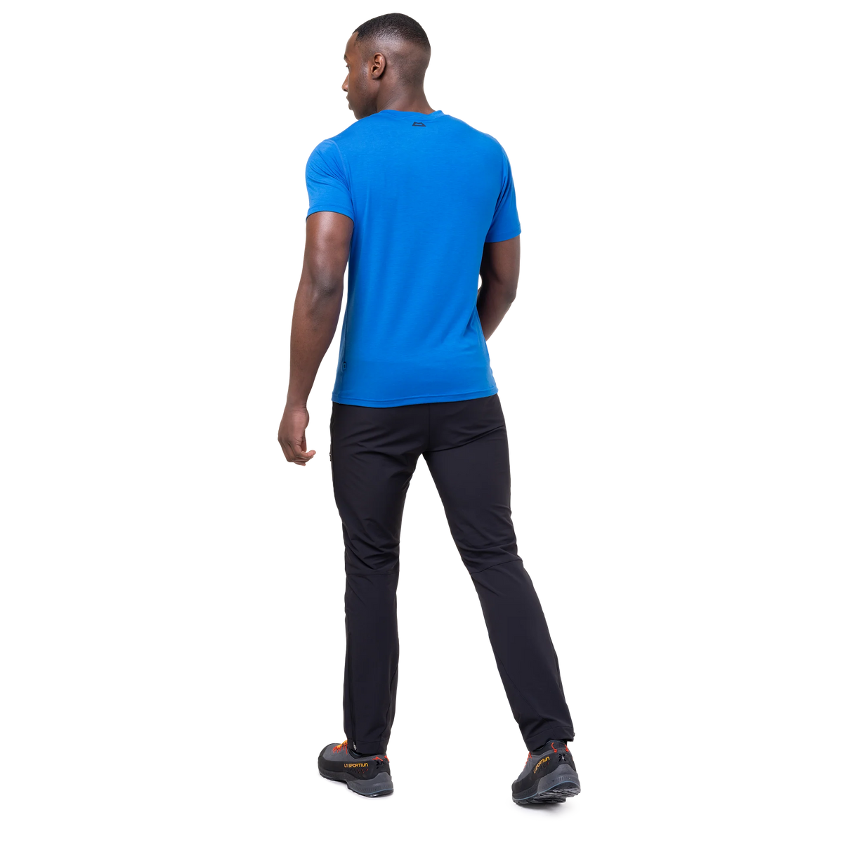 Mountain Equipment Groundup Men's Tee in Atlantic Blue - lifestyle view showing fast-drying stretchy tee for mountain walking and trekking