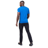 Mountain Equipment Groundup Men's Tee in Atlantic Blue - lifestyle view showing fast-drying stretchy tee for mountain walking and trekking