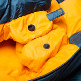Mountain Equipment Helium 400 Sleeping Bag in Majolica Blue packed into waterproof roll-top stuff sack showing compact 24 x 21 x 20 cm packed size