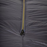 Mountain Equipment Helium GT 600 Sleeping Bag in Anvil Grey packed into waterproof roll-top stuff sack showing lightweight packable construction