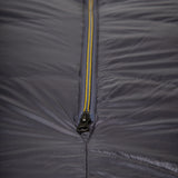 Mountain Equipment Helium GT 800 Sleeping Bag in Anvil Grey - lifestyle view showing warm roomy GT fit sleeping bag for cold-weather trekking and alpine use