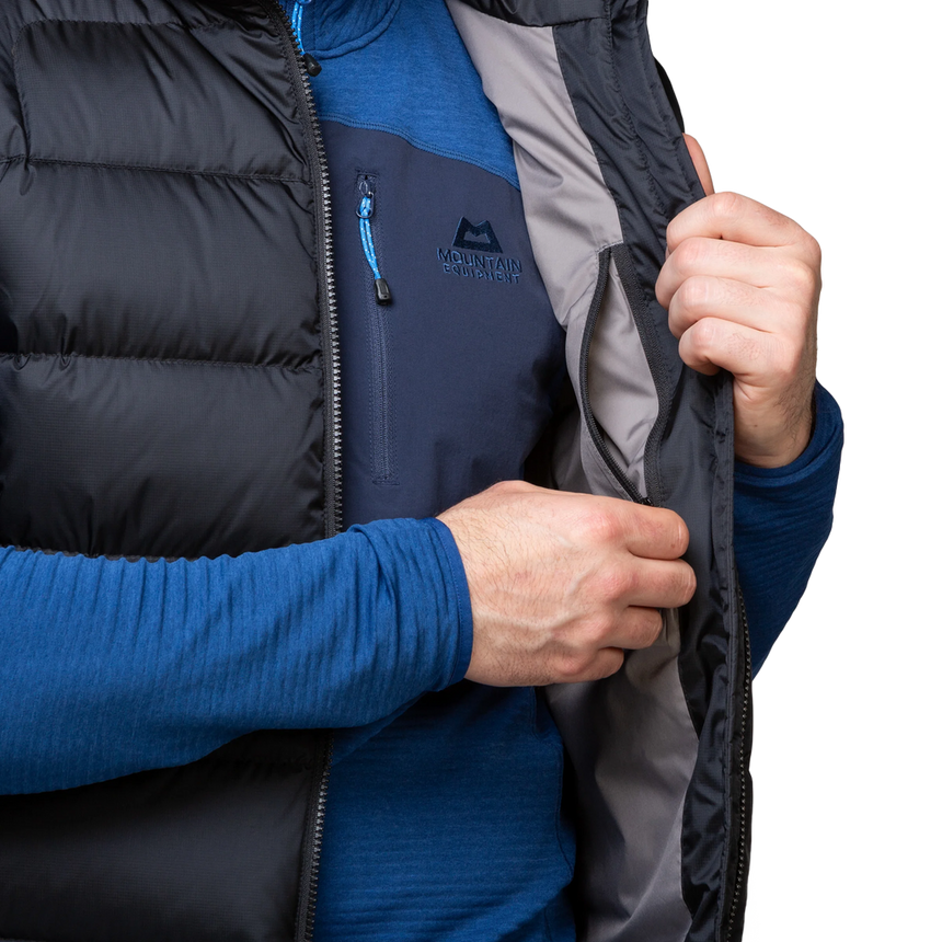Mountain Equipment Lightline Men's Vest in Black - detail view showing 2-way YKK moulded centre front zip and internal baffle construction