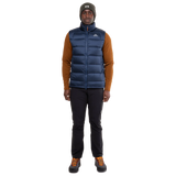 Mountain Equipment Lightline Men's Vest in Navy packed into internal pocket showing lightweight packable construction