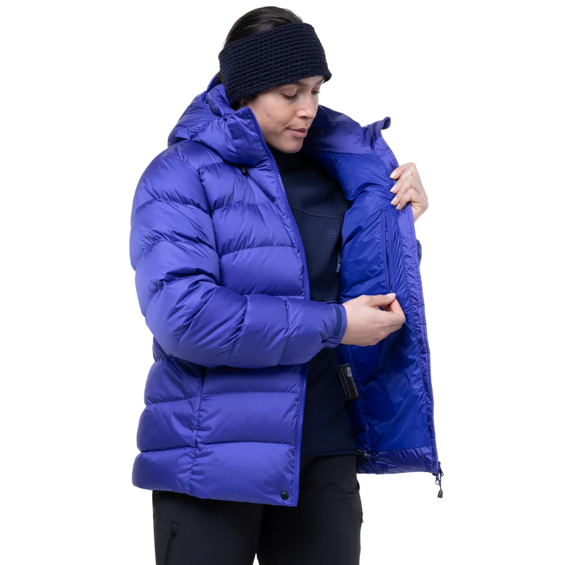 Mountain Equipment Lightline Women's Jacket in Clematis packed into stuff sack showing lightweight packable construction