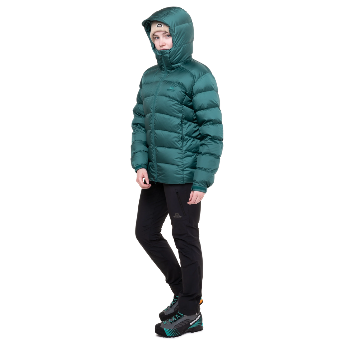Mountain Equipment Lightline Women's Jacket in Deep Teal - lifestyle view showing technical duvet jacket for mountaineering in sub-zero conditions