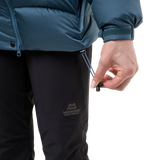 Mountain Equipment Lightline Women's Jacket in Stellar Blue - lifestyle view showing technical duvet jacket for mountaineering in sub-zero conditions