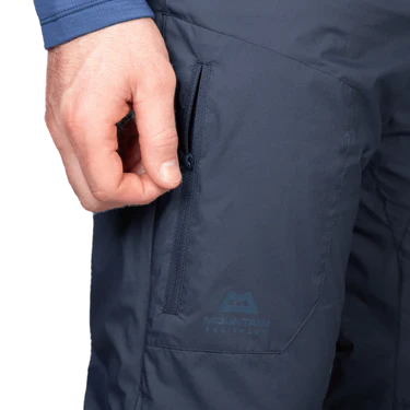 Mountain Equipment Switch Men's Pant in Cosmos - detail view showing zipped hand pocket and 20D RS Nylon wind resistant outer fabric