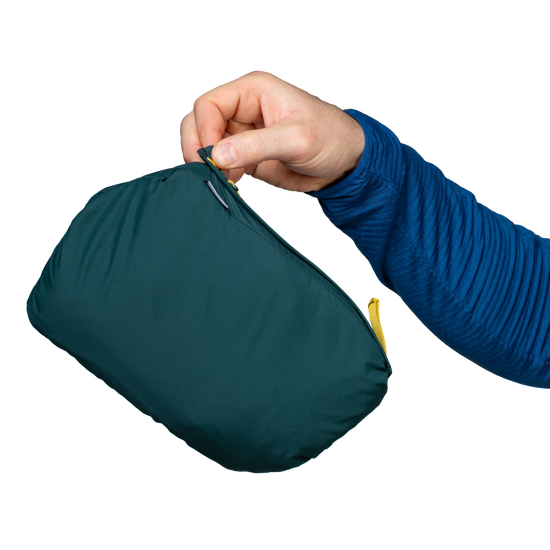 Mountain Equipment Switch Men's Vest in Pine/Fern - lifestyle view showing hybrid insulated vest for alpine climbing and ski touring