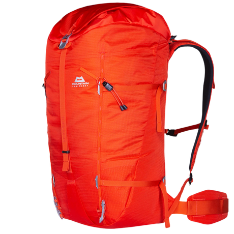 Mountain Equipment Tupilak 45+ Backpack in Magma - side view showing hourglass shape and compression straps