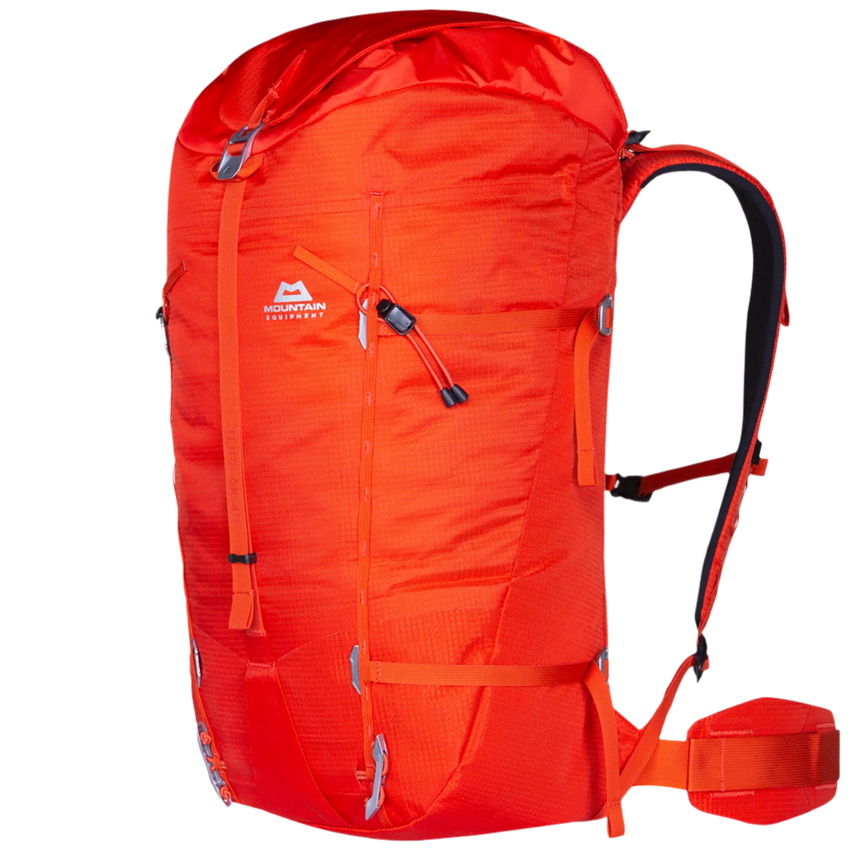 Mountain Equipment Tupilak 45+ Backpack in Magma - side view showing hourglass shape and compression straps