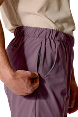 Rab Men's Momentum Shorts in Dark Iris (Reference) - worn, hand pocket detail