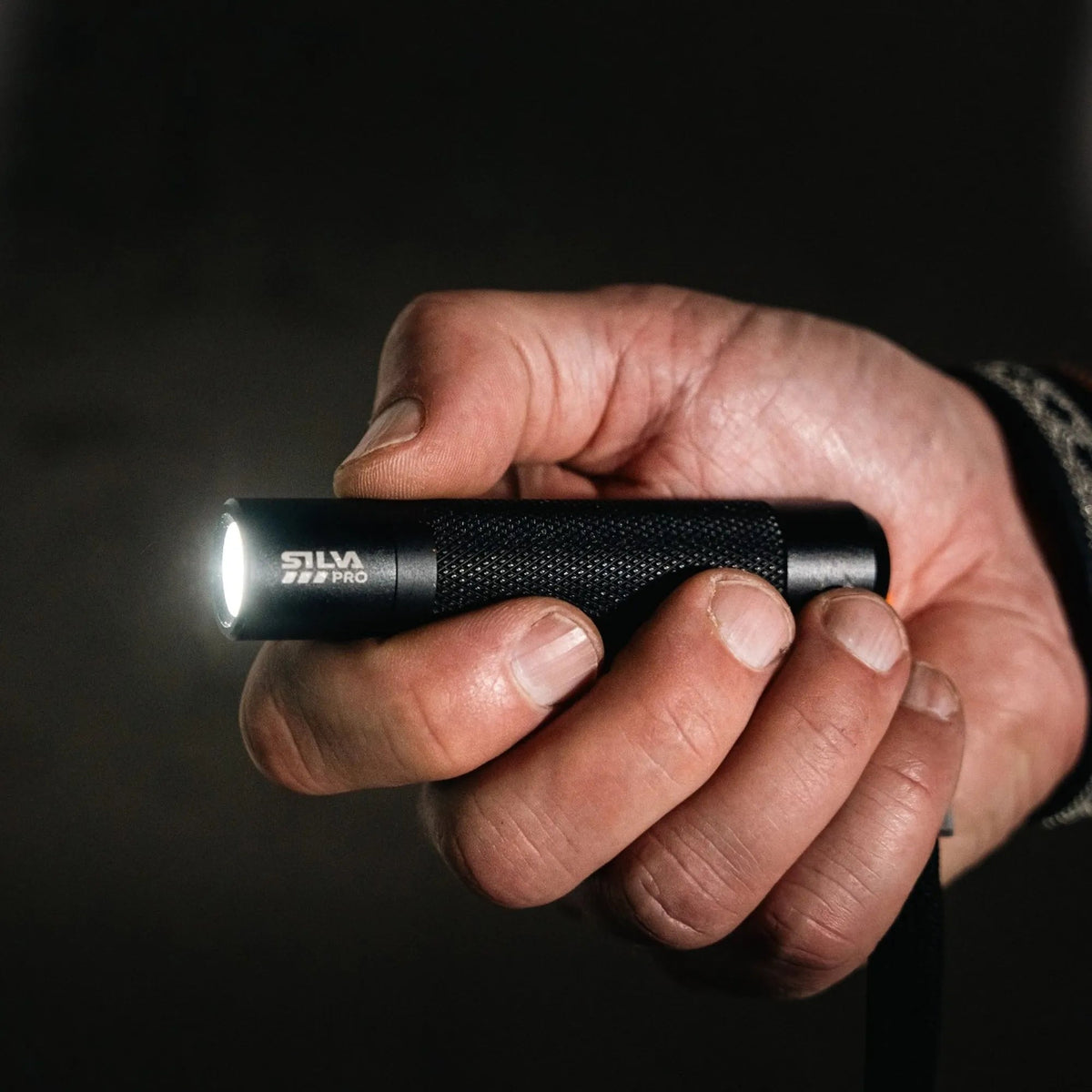 Silva Pocketlight 200 flashlight in hand