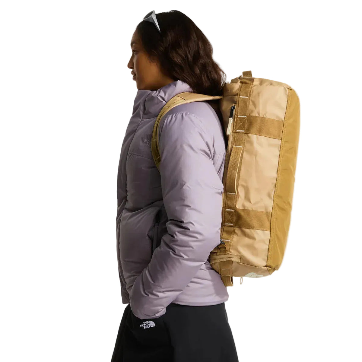 The North Face Base Camp Voyager Duffel 32L Khaki Stone/Utility Brown - side view with detachable padded shoulder straps and grab handles
