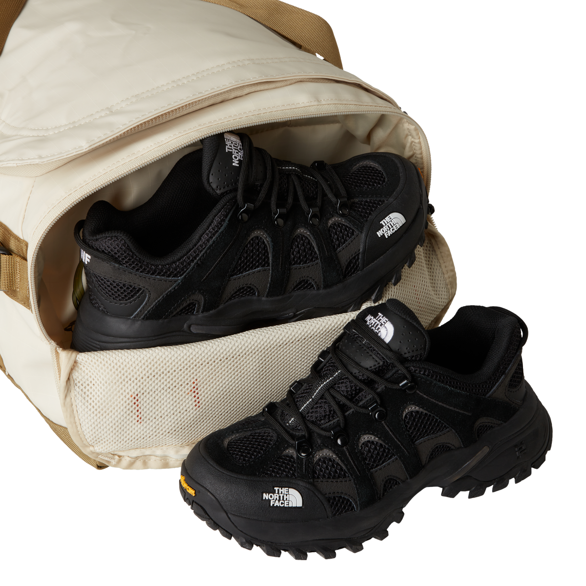 The North Face Base Camp Voyager Duffel 42L Desert Stone/Cedar/Desert Rust - lifestyle shot showing versatile backpack and duffel carry options with 42 litre capacity