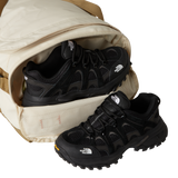 The North Face Base Camp Voyager Duffel 42L Desert Stone/Cedar/Desert Rust - lifestyle shot showing versatile backpack and duffel carry options with 42 litre capacity