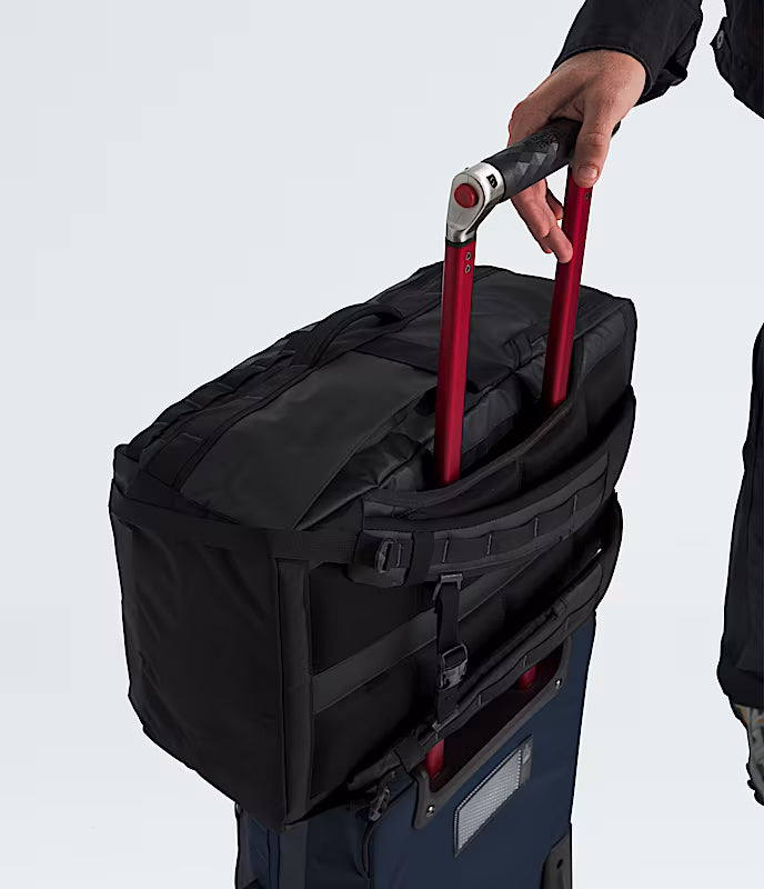 The North Face Base Camp Voyager Travel Pack 35L Black/Asphalt Grey - lifestyle shot showing 35 litre capacity and reflective details for travel and daily commuting