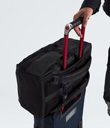 The North Face Base Camp Voyager Travel Pack 35L Black/Asphalt Grey - lifestyle shot showing 35 litre capacity and reflective details for travel and daily commuting