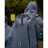 Red Paddle Waterproof Kit Bag - Model Wearing Bag on Back Outdoors