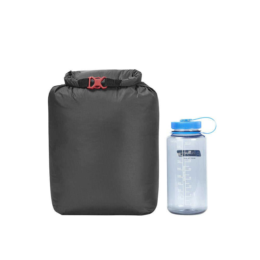 Mountain Equipment Glacier 700 Sleeping Bag in Imperial Red packed into waterproof roll-top stuff sack